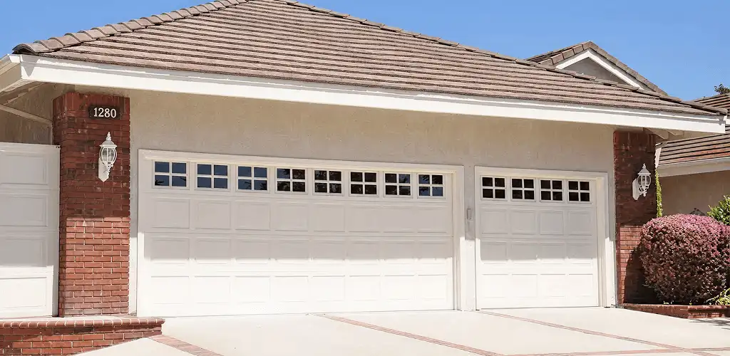 Residential garage door repair service for a double garage door in Ann Arbor, MI