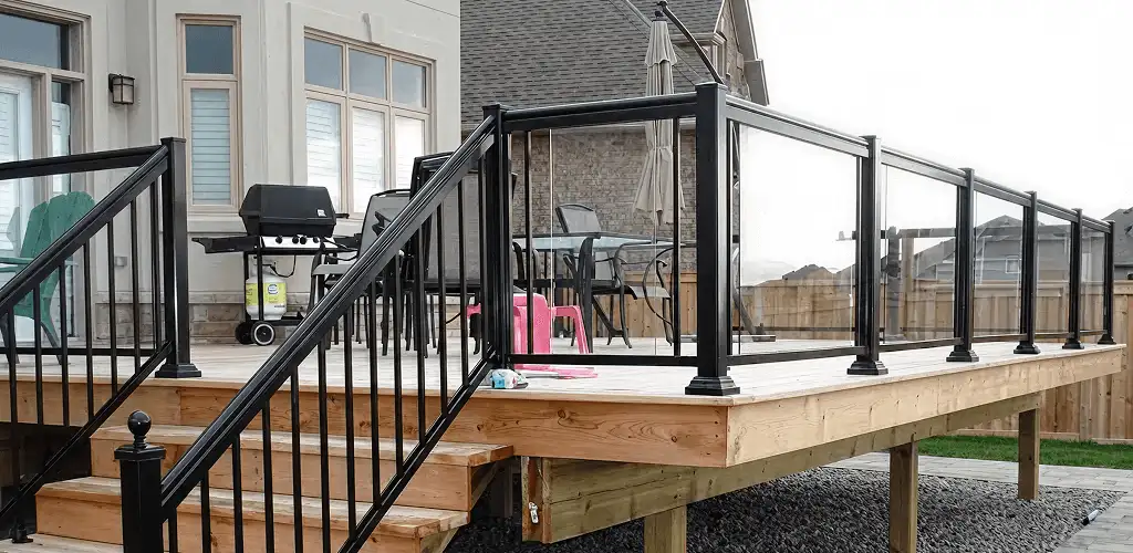 Handrail installation on a deck staircase for safety and code compliance in Ann Arbor, MI